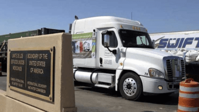 a white truck parked on the side of a road